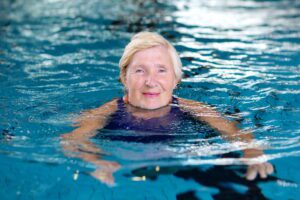 Elderly lady who searched ‘adult swimming lessons near me’ in pool